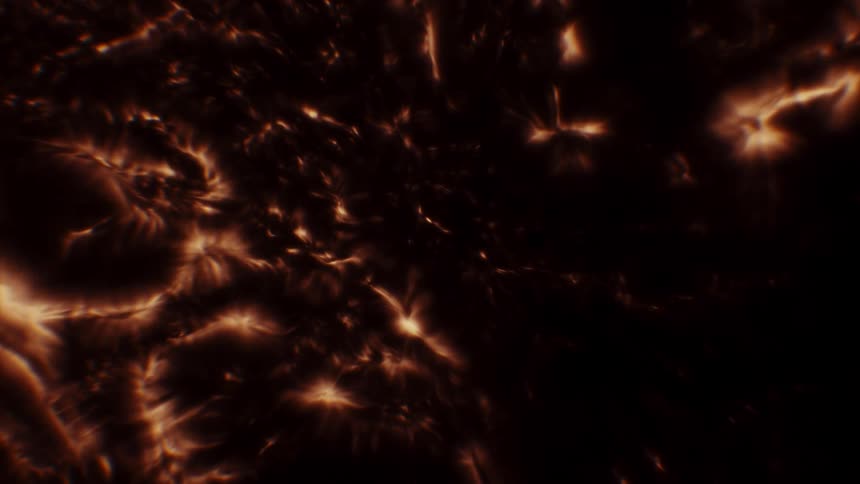 Slowly moving abstract orange caustic patterns glow against a black background