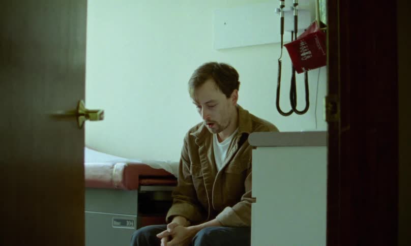 A man anxiously waits for the doctor