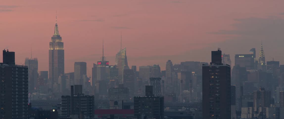 View of a cloudy city at dusk