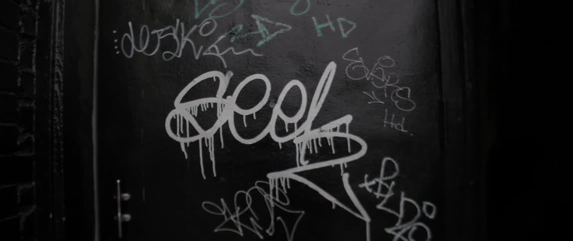 Graffiti covers a metal door