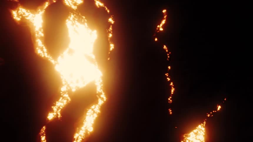 Glowing orange embers slowly burn and spread across a black surface in an intricate pattern