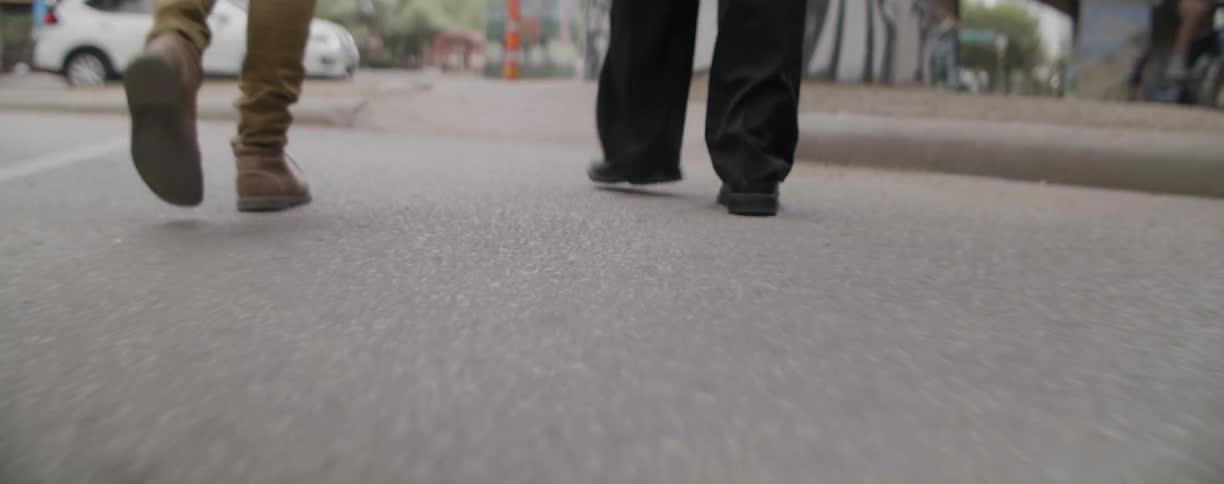 People walking down the street in a busy city