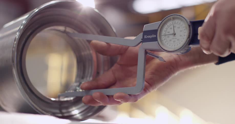 A person is using a device with a scale
