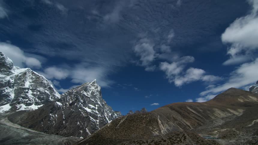 Snow covered mountains and a cloudy sky