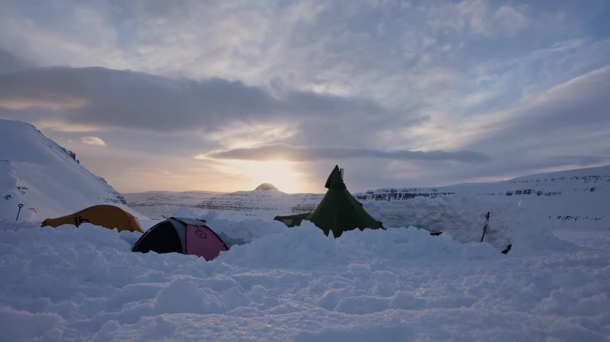 From the dark of night to a brilliant sunrise, a timelapse captures the morning routine at a winter camp set in deep snow