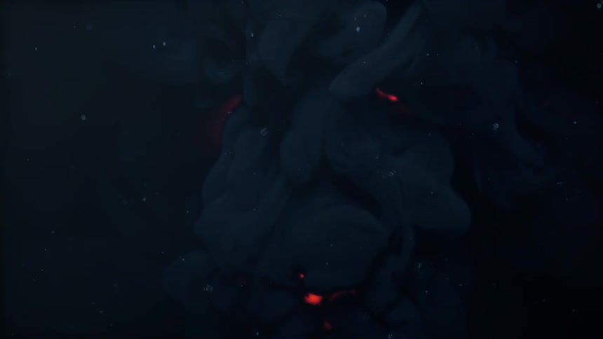 Mysterious dark blue ink billows and expands, revealing glowing red embers within its depths