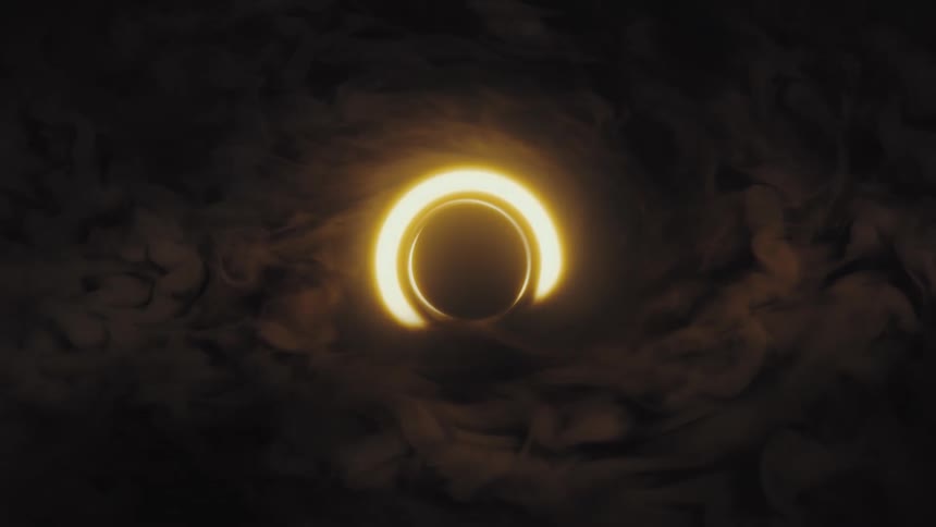 A stylized animation of a solar eclipse or black hole reveals a glowing golden ring amidst dark, swirling cosmic clouds