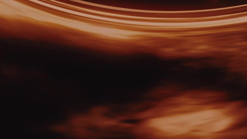 A slow-moving abstract background of a glowing golden ring revealing dark, swirling cosmic clouds