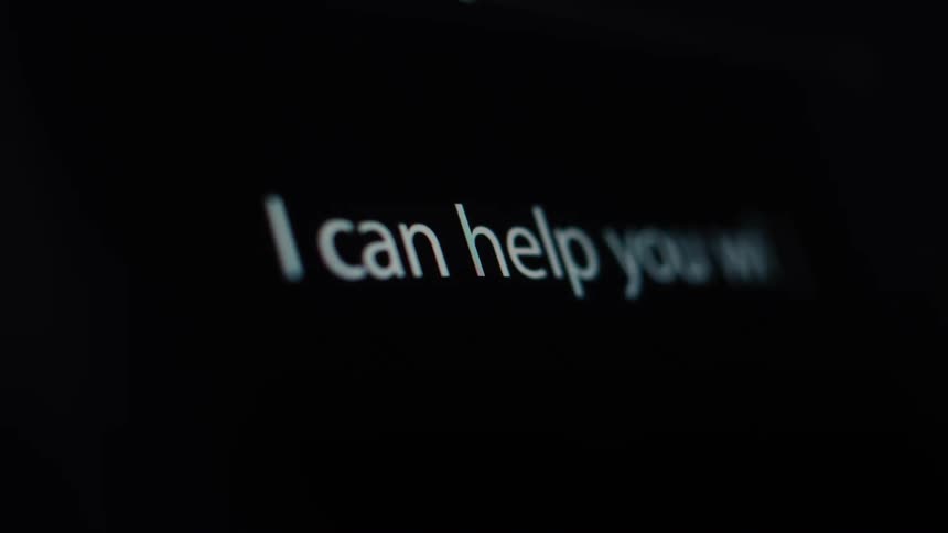 A close-up of a computer screen showing the words 'I can help you with that' being typed out