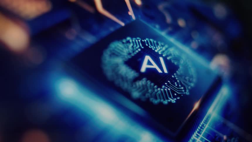 Futuristic animation shows a glowing AI logo and brain circuit on a computer processor