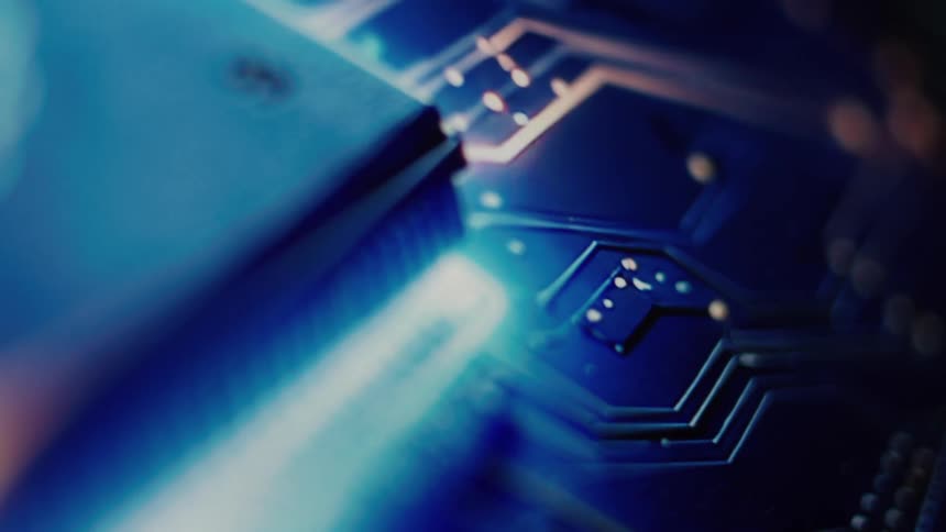 Abstract macro shot of a glowing blue circuit board with intricate pathways and connections