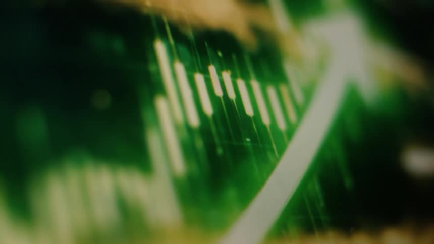 A close-up, abstract shot of a green stock market candlestick chart with an upward arrow indicating positive growth and a bull market
