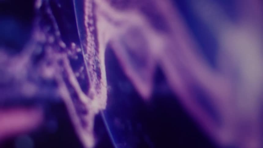 A mesmerizing close-up of a glowing purple digital waveform undulating against a dark background