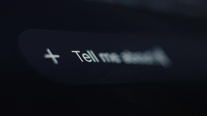 Close-up shot of a user typing a question into a modern search bar or AI chatbot with a blinking cursor