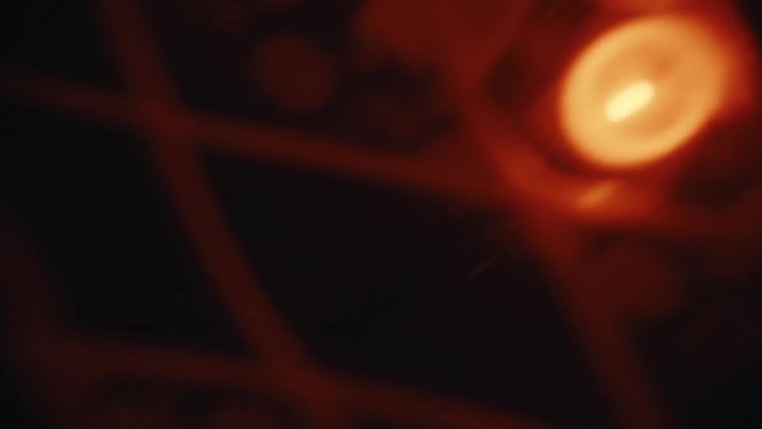 A hazy, abstract shot captures the warm, flickering glow of out-of-focus lights, creating a soft bokeh effect