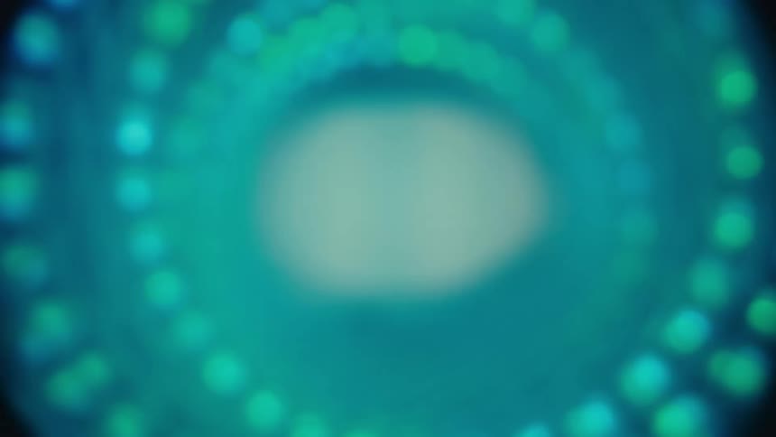A mesmerizing pull-out shot reveals a swirling, web-like tunnel of abstract blue light