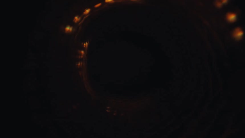 A mesmerizing abstract visual of traveling through a colorful, spiraling LED light tunnel