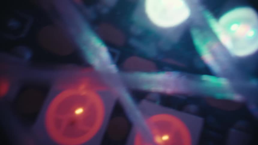 A mesmerizing extreme close-up shot of colorful LED lights blinking and flashing on a circuit board in a dynamic pattern