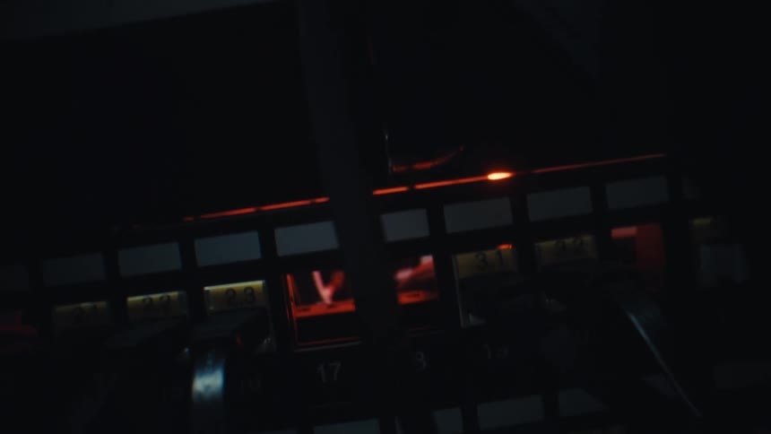 A close-up of a working server router with flashing lights indicating data transfer in a dark room