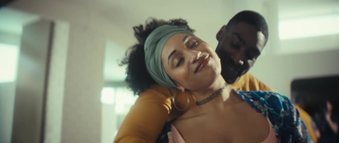 Slow motion shot of a loving black couple dancing intimately together at home