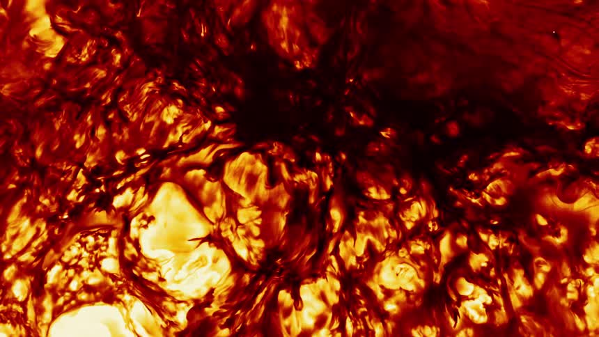 Fiery abstract patterns of red and yellow swirl and evolve like molten lava