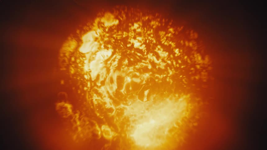 An abstract macro shot reveals a fiery, pulsating orb glowing with intense heat and light before expanding and fading
