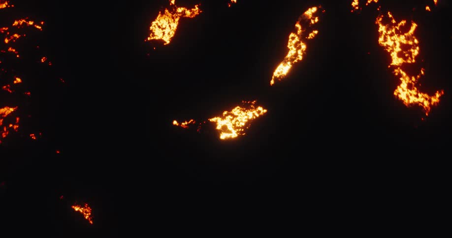Molten volcanic lava slowly cools and cracks, revealing the fiery hot core underneath against a black background