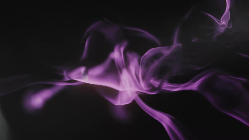 Abstract purple smoke creates a mesmerizing and mystical visual against a black background