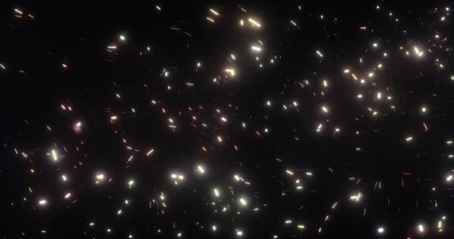 Abstract colorful light particles dance and streak across a dark background