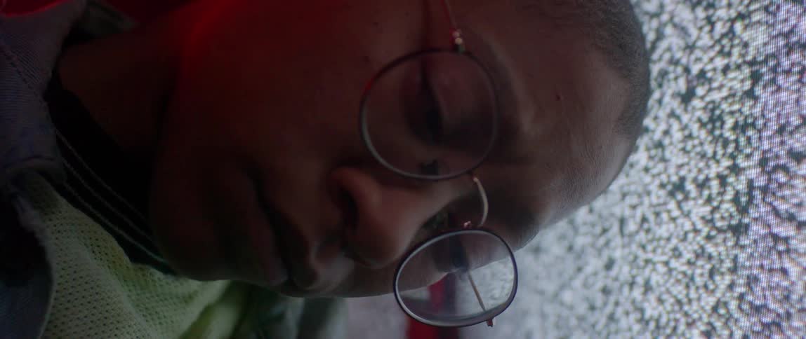 A person's sleeping face with static in the background