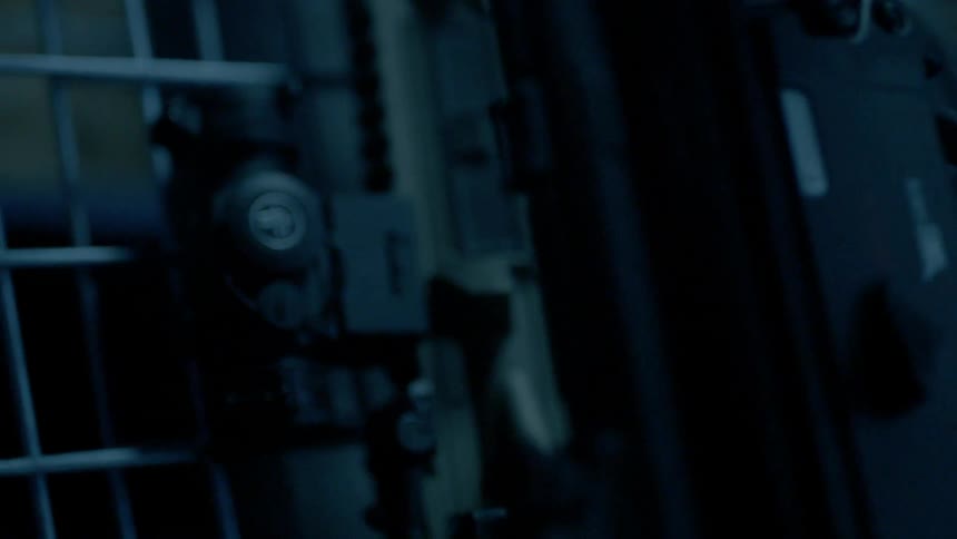 A rack is filled with rifles