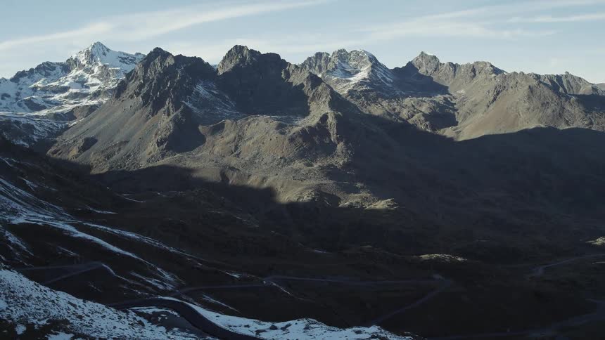Mountain ridges are dusted with snow