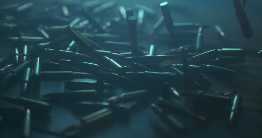 Bullet shells fall slowly on the ground