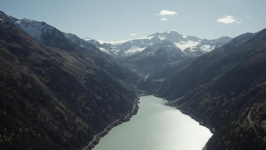 A river runs through snowy mountains