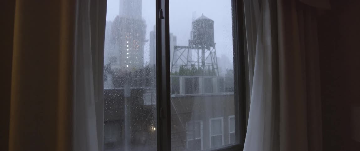 Outside the window it is stormy in the city