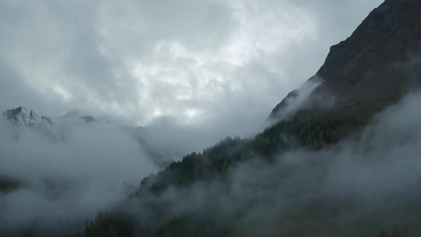 Fog covers these high mountains
