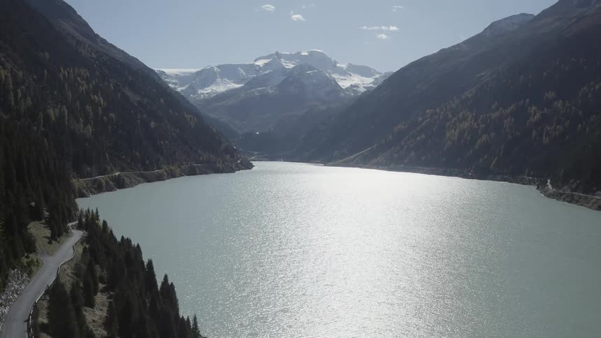 Large lake surrounded on every side by tall mountains