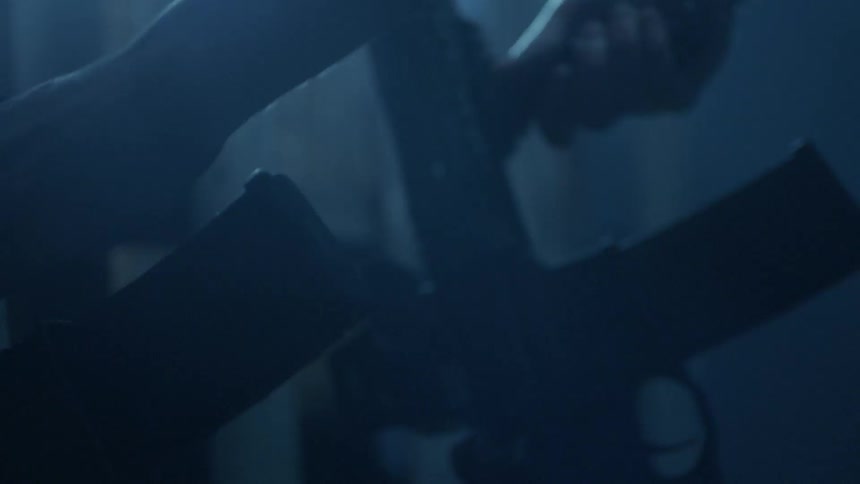 Close up of person grabbing a firearm