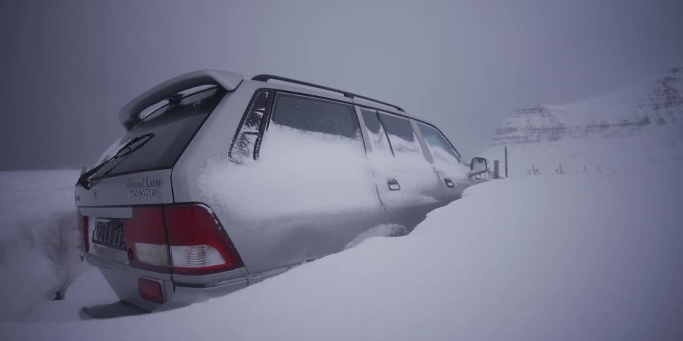 Time-lapse footage shows an SUV emerging from a deep snowdrift after a severe winter storm