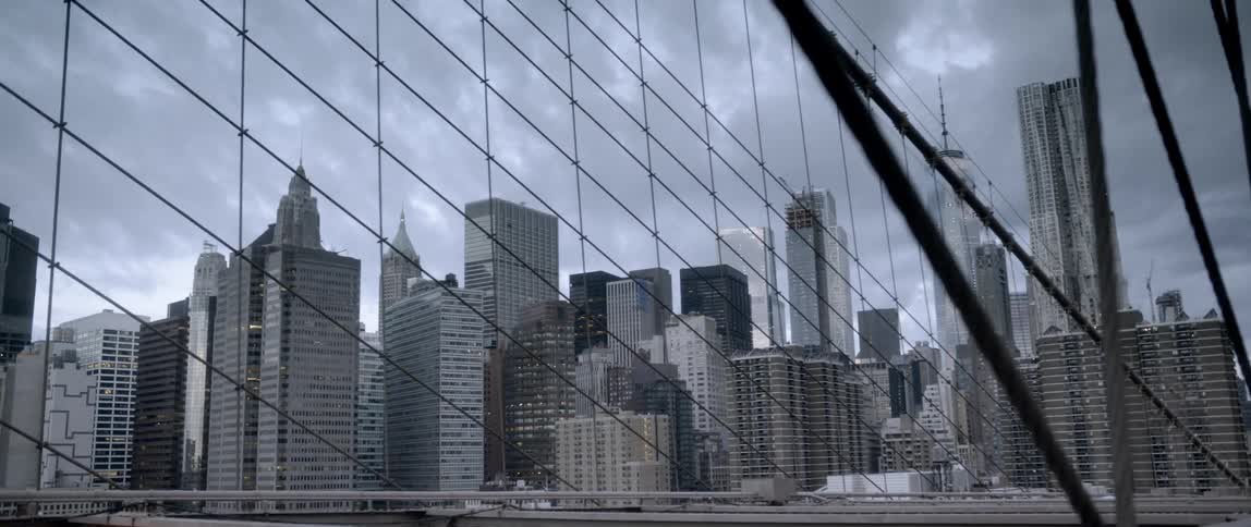 View looking off of a bridge out at a large city
