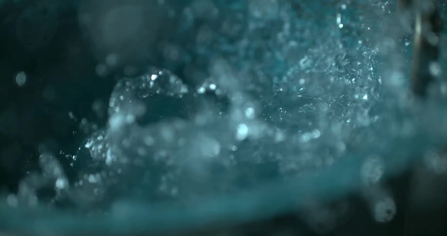 Close up of water splashing and spilling