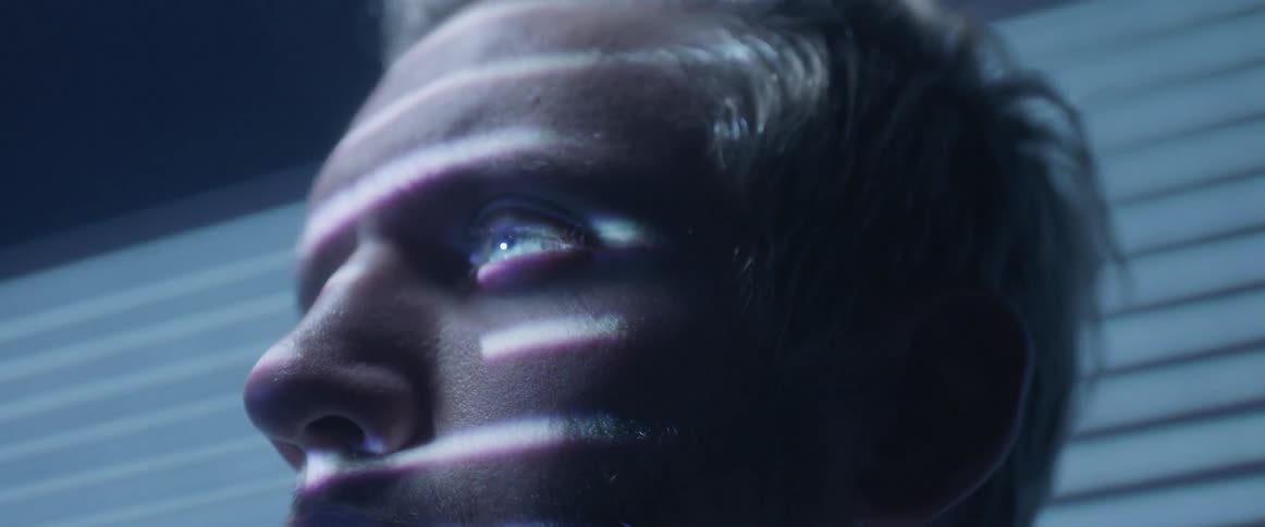 A wakes up as lights flash on his face