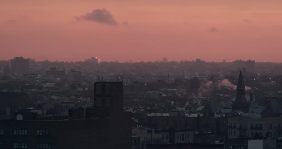 View of a city as the sunset turns the sky red