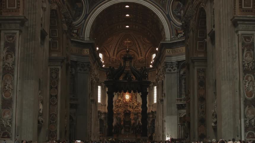 People walk in a cathedral