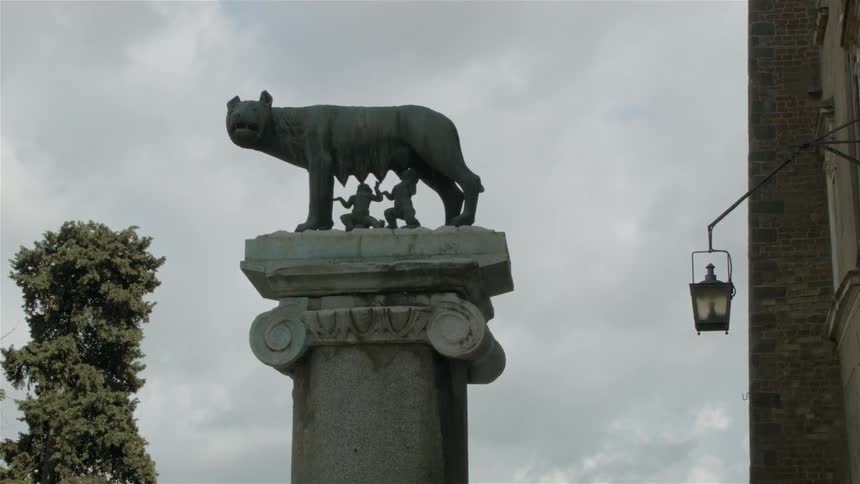 An animal statue sits atop a pillar