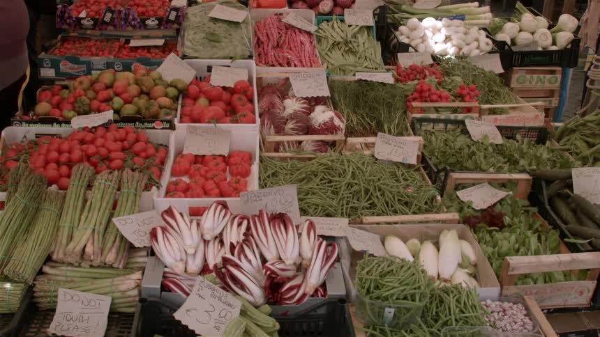 Fresh produce in boxes in front of the market