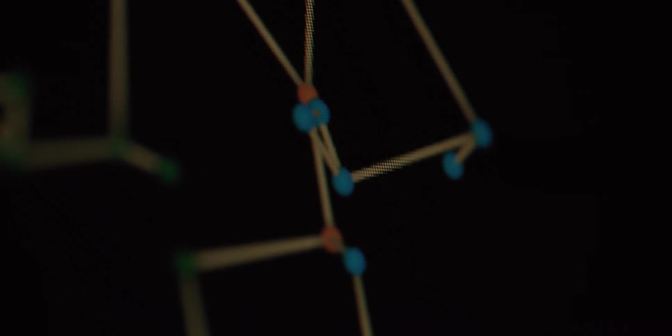 A colorful abstract digital network of nodes and connections slowly rotates in a dark, out-of-focus space