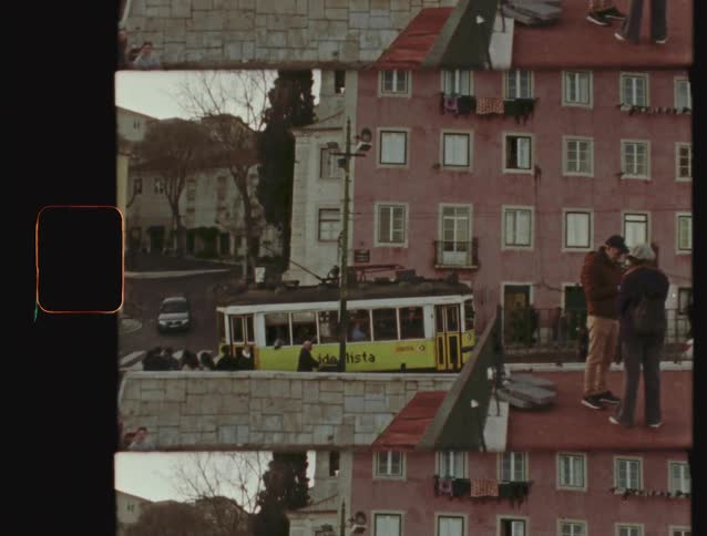 Vintage split-screen footage captures an iconic yellow tram navigating the charming, colorful streets of Lisbon, Portugal