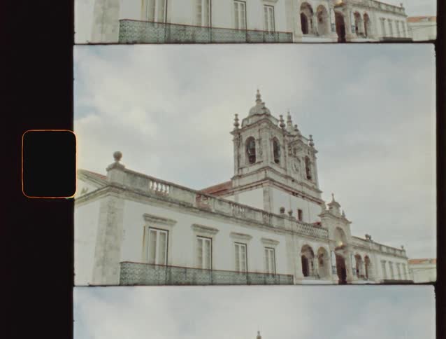 Vintage film footage captures an upward tilt of the historic Sanctuary of Our Lady of Nazaré in Portugal