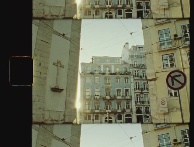 A split-screen, vintage film style shot captures a sunny afternoon on a busy European city street with cars and pedestrians